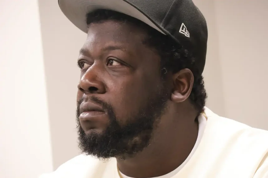 Garrison Gibson, 38, speaks at a Saturday press conference about his arrest after masked ICE agents broke into his north Minneapolis home on Jan. 11.